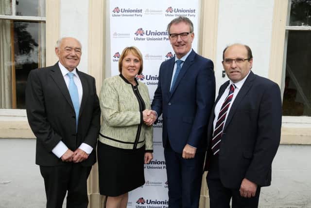 Press Eye - Belfast  - Northern Ireland -  2nd September 2015 - 

Ulster Unionist Party leader Mike Nesbitt pictured with new members John Palmer and Jenny Palmer. 

Also pictured is Lisburn and Castlereagh City Councillor  Jim Dillon (left).

Picture by Press Eye