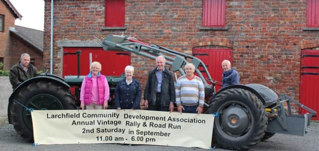 Brian McCallister, Patricia Halliday, Karen McCallister, Laurence Hooke, Ernie McCallister and Bertie McCallister preparing for the Larchfield Community Association Family Fun Day and Vintage Rally.