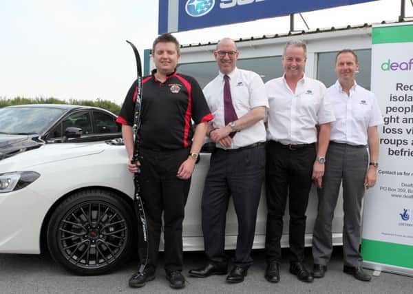 From left to right: Johnboy Nicholl with Subaru NI dealers Noel Gormley, Pat McCaffrey, Des Eastwood.