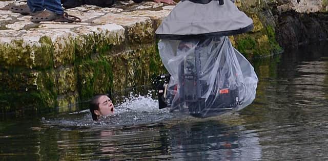 HBO's tv show Game of Thrones actress Maisie Williams who play's Arya Stark pictured getting into the water during filming at  Carnlough last month. Picture By: Arthur Allison/Pacemaker Press