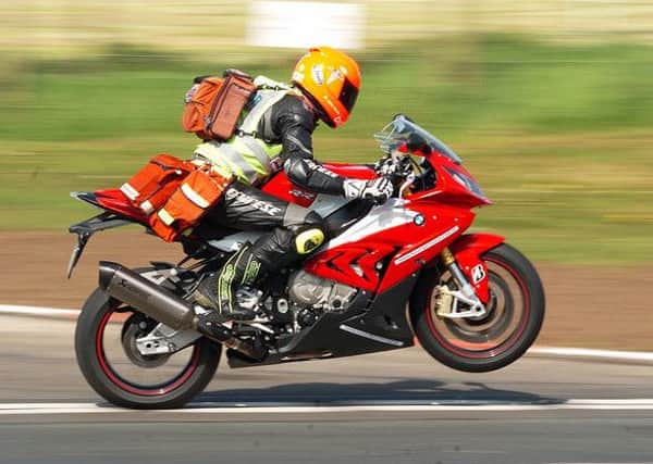 Dr John Hinds on a medical bike at the North West 200 in 2015.