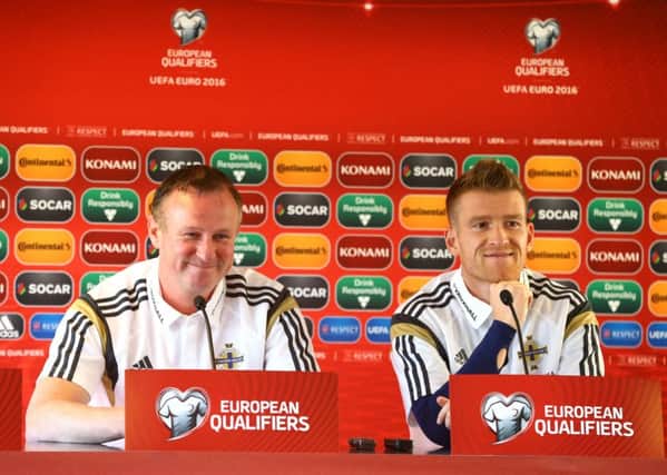 Northern Ireland manager Michael O'Neill and captain Steven Davis during Thursday night's press conference at the Torsvollur stadium in Torshavn ahead of Friday night's Euro 2016 2016 Qualifier against the Faroe Islands. Picture: Press Eye.