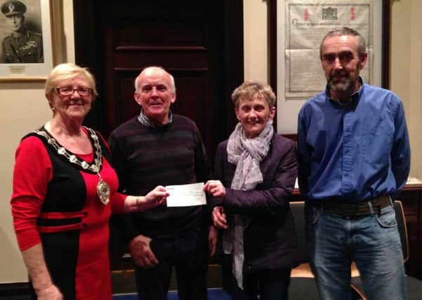 FLASHBACK: Ballymena Road Club - Chain Reaction - Fun Tour cyclists presented a cheque for £1089 to The Chernobyl Children's Appeal NI at a Town Hall reception last week. Included are (from left): Audrey Wales (Mayor of Ballymena); Patsy McGurk (BRC touring section chairman); Eleanor Duffin (CCA); and Pius McKernan (BRC tourning committee). Submitted picture.