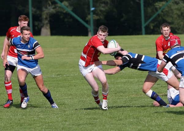 This Coleraine player does his best to try and bring down the Randalstown attack. INBT37-271AC