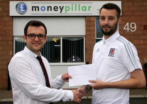Charles Allen of Money Pillar (and also Strollers captain) is pictured presenting a sponsorship cheque to Jason Connolly, manager of Wakehurst Strollers. INBT37-204AC