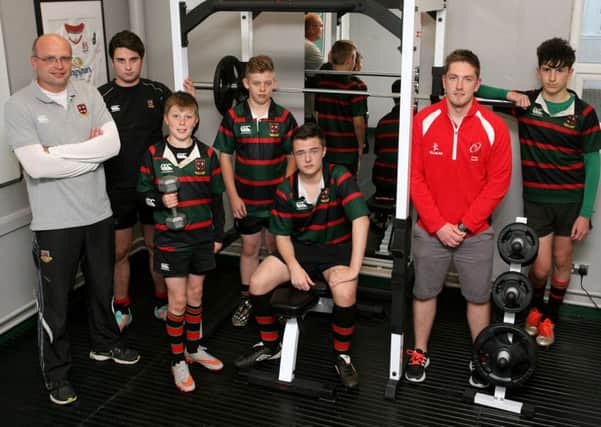 Warren Beattie (strength and conditioning coach) and Michael Glass (coach) are pictured with Cambridge House students: Harry Speers, Adam Brannigan, Jordon Millar, Calum Crawford and Robbie Grey with some of the school's new gym equipment. INBT36-204AC