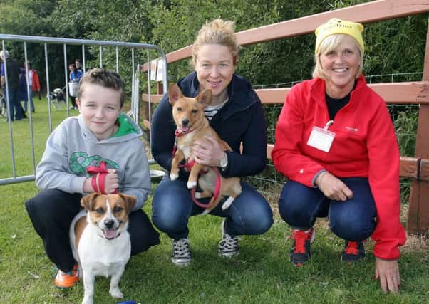 Dogs Trust volunteer Lucile O'Flaherty with Jennifer and Edward Morrison and dogs Tia and Minnie. INBT37-261AC