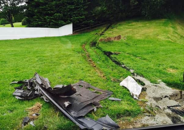 The grass verge where parts of a crashed car remained on Sunday