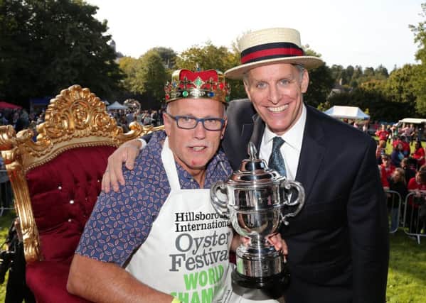The still undefeated World Oyster Eating Champion Colin Shirlow with compere George Shea who flew in from New York for the competition.  Picture by Darren Kidd / Press Eye