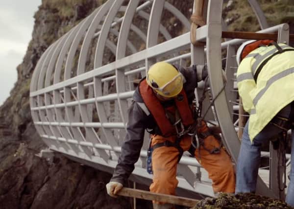 One of the steel walkways is fitted to the rock surface at The Gobbins.