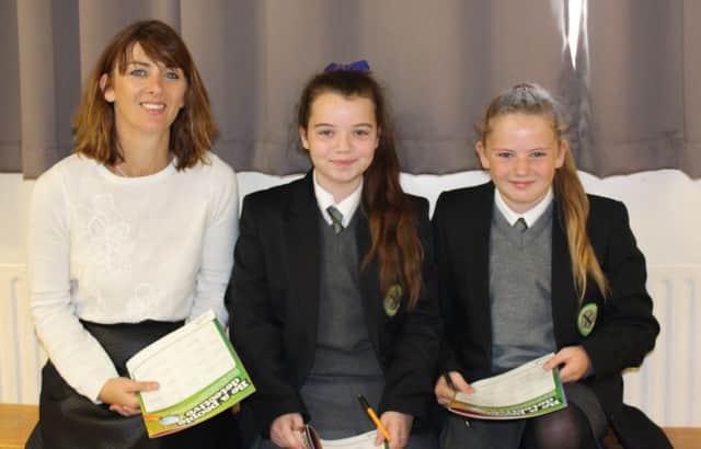 Jane McGeary (Young Enterprise) with St Patricks Pupils Caitlin McMahon and Emma McKeown.