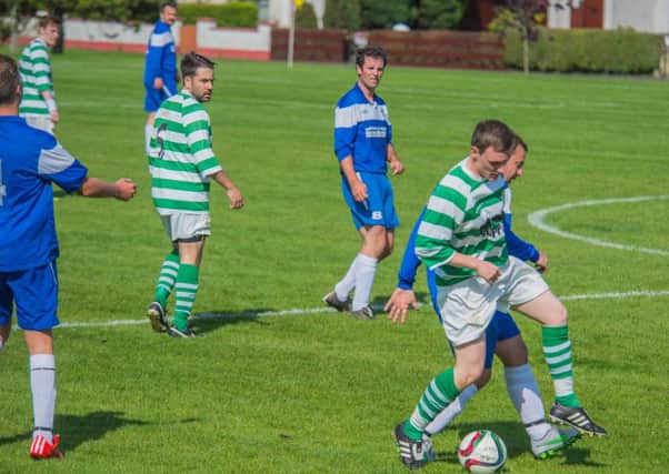 Holding off pressure from Bourneview Mill during Lurgan Celtic's success in the reserves' Wilmor Johnston Memorial Cup.INPT35-321