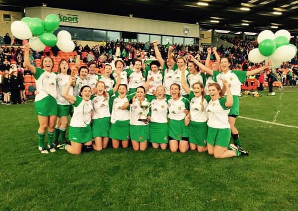 St Mary's Aghagallon ladies celebrate success in the Armagh Intermediate Camogie Championship final against Mullaghbawn.INLM37-180