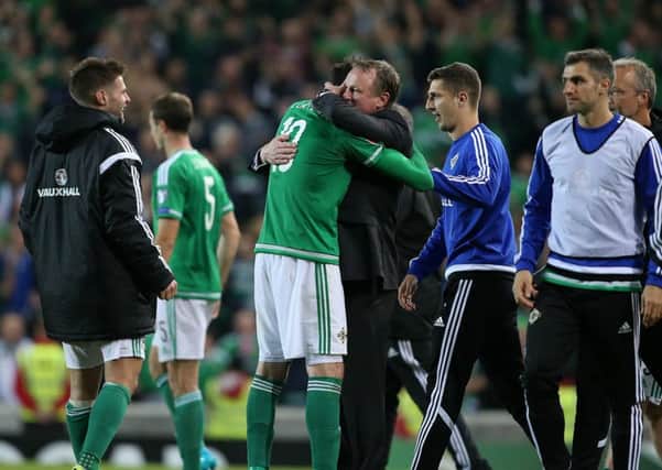Northern Ireland manager Michael O'Neill celebrates with goalscorer Kyle Lafferty after the striker's late equaliser in the Euro 2016 qualifier against Hungary. Picture: Press Eye.
