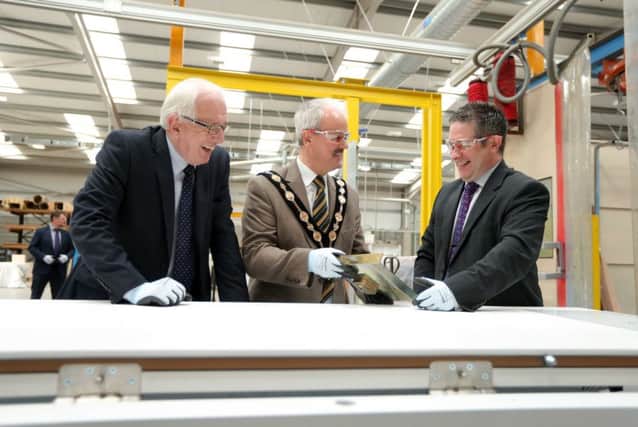 Alderman Allan Ewart, Chairman of the Council's Development Committee and the Mayor, Councillor Thomas Beckett enjoy a tour of the Lisburn site of ASSA ABLOY Security Doors, the global leader in door opening solutions from Managing Director Brian Sofley.