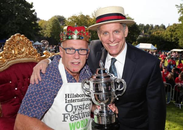 The still undefeated World Oyster Eating Champion Colin Shirlow with compere George Shea who flew in from New York for the competition.  Picture by Darren Kidd / Press Eye