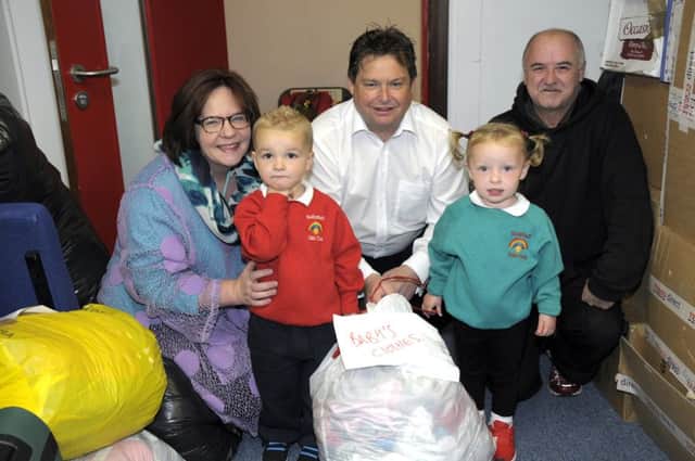 Bagging up donations in Ballyduff: Stephanie McVicker, Mark Cosgrove, Tommy Mooney and playgroup pupils Kamryn and Lewis. INNT36-208-AM