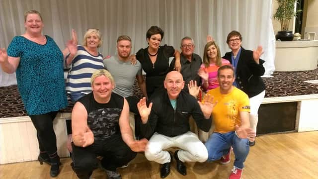 JAZZ HANDS... The Strictly Musicals dancers enjoying rehearsals with organiser Gerald McQuilken (front right). INBM38-15 UC