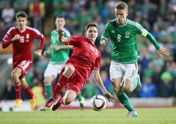 Northern Ireland's Steven Davis gets away from Hungary midfielder Zoltán Gera during Monday night's UEFA EURO 2016 Qualifier.