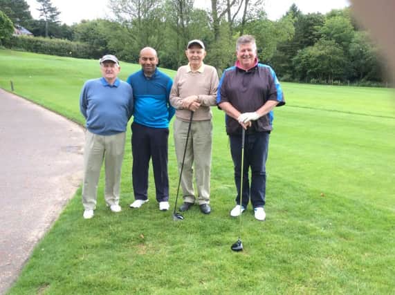 Tommy Patterson, Thomas Hillman, Ivan Darragh and Dennis Sheridan leaving the first tee at Dunmurry Golf Club.