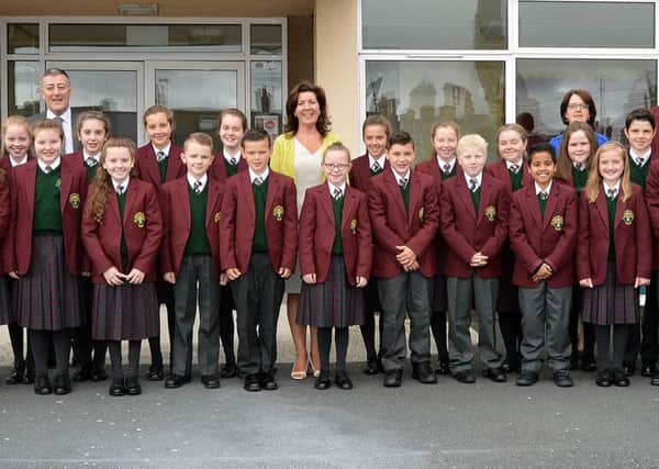 Some of the Year 8 intake at the new St. Ronan's College pictured on their first day with staff from left,  Dr Fionnuala Moore, viceprincipal,  Mr Charlie McConville, vice principal, Mrs Michele Corkey, principal, Mrs Ita Cosgrove, vice principal, and Mr Sean Finn, form teacher. INLM36-202.