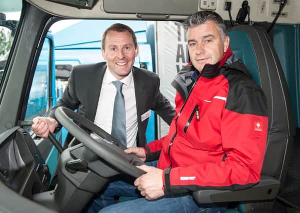 Group sales director Rob Ireland and Stephen Robinson in one of the trucks from the new range. INNT 38-805CON
