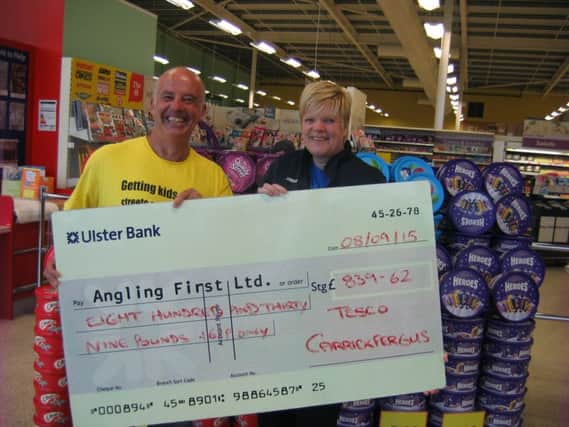 Presenting the proceeds from a recently held store collection at Tesco Carrickfergus to Angling First development officer Mark McGivern is the store's community champion Ann Ritchie. Angling First would like to thank all those who supported the effort.The money raised will assist the charity in delivering it's services throughout the Carrickfergus area. Groups interested in a day's fishing courtesy of Tesco Carrickfergus are welcome to contact the store community champion who has a number of complimentary days available. The total amount raised was £839.62. INCT 37-751-CON