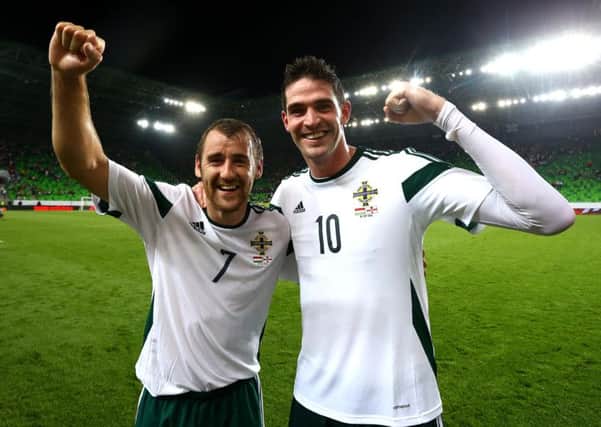 Northern Ireland goal heroes Niall McGinn and Kyle Lafferty celebrate scoring against Hungary in their UEFA EURO 2016 win in Budapest. Picture by William Cherry/Presseye