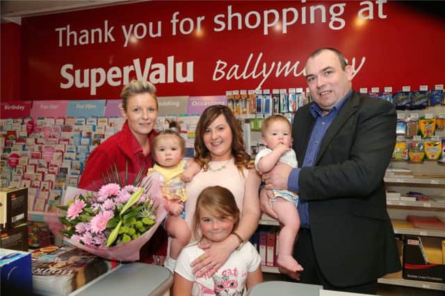 Emma McAllister from Cushendall has been announced as SuperValu Ballymoneys finalist in the 2015 SuperValu SuperMums campaign.  Emma is pictured with her children and SuperValu Ballymoneys Mandy Mairs and store manager, Ian Elliott. INBM38-15