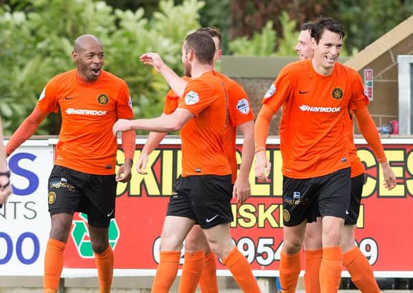 Carrick Rangers' Miguel Chines celebrates his goal with team mates making it 2-0 before half time against Ballinamallard United. INLT 38-905-CON Photo: Presseye