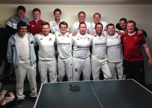 Ballymena Second XI cricketers celebrate their league title success.