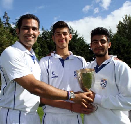 Varun Chopra (centre) pictured with his uncle Tim (left) and brother Rishi at last week's trophy presentation. Picture by Barry Chambers / Press Eye