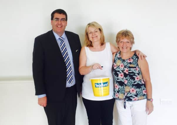 Stephen and Myrtle Moutray with Janice Barr form Charlene's Project at the charity coffee morning.