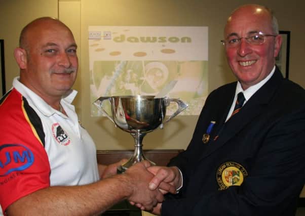 John Gilliland winner of the Open Singles Competition receiving the Dawson Manufacturing & Engineering Murphy Cup from Club President, Stephen Poots.