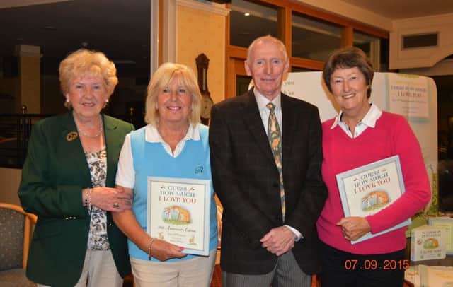 Author Sam McBratney and Lisburn Lady Captain, Margaret Boyd pictured with Joy Hall and Sylvia Carr who finished in first place in the Sam McBratney Greensomes Competition held at Lisburn GC. They were presented with a 20th Anniversary Edition of Sams famous book, Guess How Much I Love You.