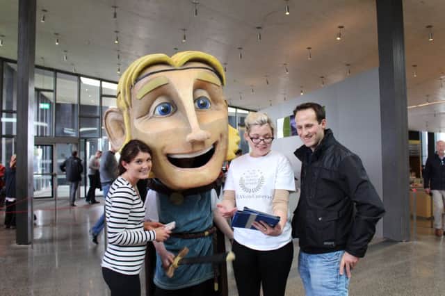 Visitors Katie Rafter and Leslie Stanley are pictured with Finn McCool and Roisin McGinn of the National Trust at the BTA Voting drive on Saturday at the Giants Causeway Visitor Centre.