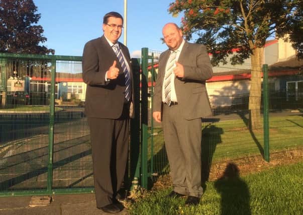 Stephen Moutray and Mark Baxter give the thumbs up for the new gate.