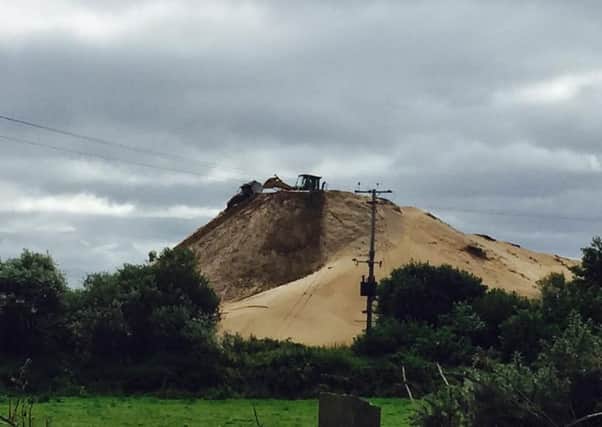 Toome locals said they have never seen the piles of sand being taken from the bed of Lough Neagh, grow so big
