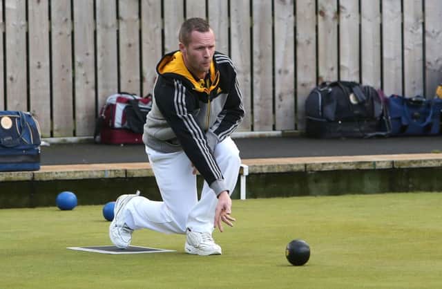 Peter Convery bowling for Dunbarton. Pic: Presseye