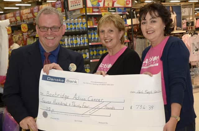 Tesco Community Champion David McKay presented a cheque for £734:38, proceeds from a store collection at Tesco Extra, to Anne Hulme and Mairead Woods towards Banbridge Action Cancer ©Edward Byrne Photography INBL1538-200EB