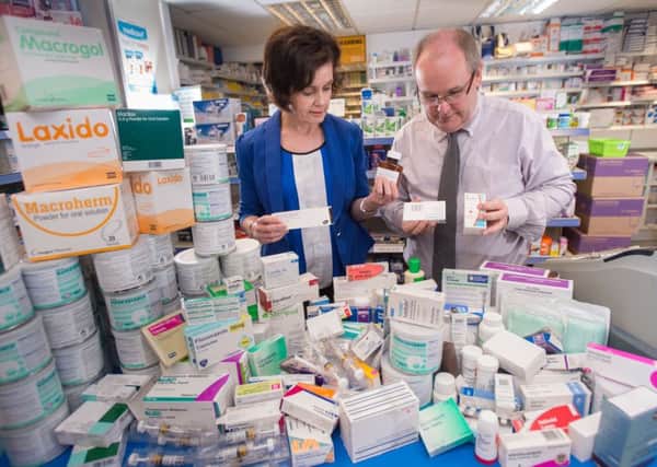 Lindsey Gracey (Pharmacist, Ballykeel Pharmacy) and Bride Harkin (Commissioning lead, Northern Local Commissioning Group, HSCB) show how much wasted medicines are returned to pharmacies in Northern Ireland. Submitted picture.