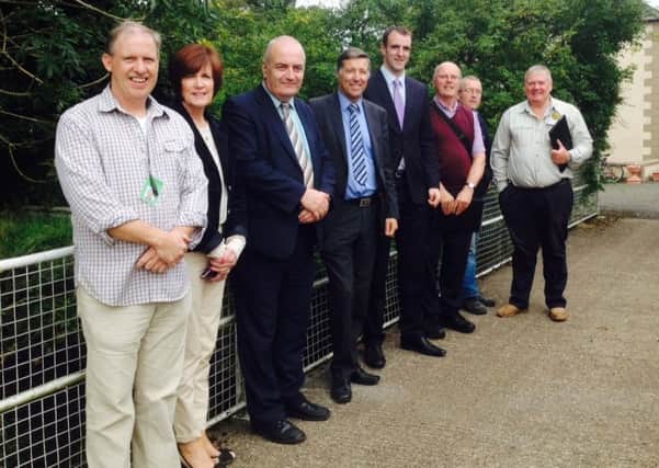 Minister Mark H Durkan (fourth from right) with South Antrim MLAs Trevor Clarke and Paul Girvan, Cllr Noreen McClelland, Michael Martin, Six Mile Water Trust, Maurice Parkinson, Chairman of Antrim & District Angling Association, Robbie Marshall, Ulster Angling Federation, and Sam Curry, Six Mile Water Trust. INNT 39-525CON