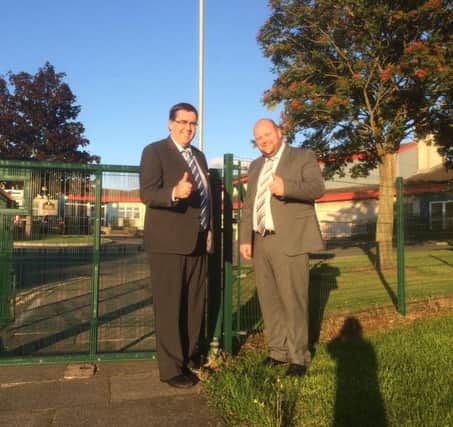 Stephen Moutray MLA and Mark Baxter give the thumbs up to Donacloney Primary School's new gate.