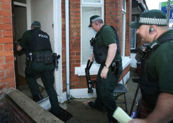 PSNI officers carry out a drugs raid on a house in East Belfas. Photo-  Niall Carson/PA Wire