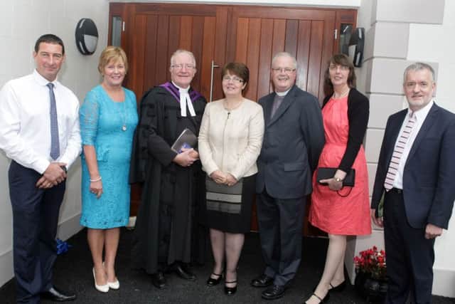 OFFICIAL. Moderator Rev Ian McNie, who officially opened the new hall at Finvoy Presbyterian Church on Saturday, pictured along with his wife Anne, Minister Rev Roy Gaston and his wife Andrina, Stephen Wylie of Wilson & Mahwhinney Builders, Mabel Campbell, who presented sissors for the ribbon cutting and Roy Greer of RJ Studio Architects.INBM39-15 019SC.