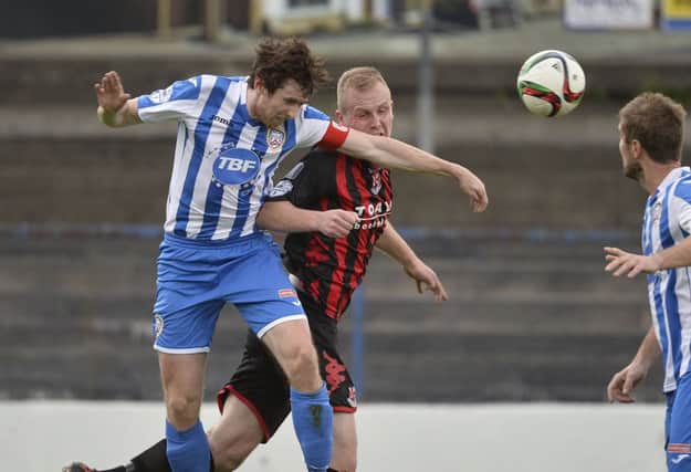 Coleraine's Howard Beverland in action with Crusaders' Jordan Owens.
Picture by Press Eye.com