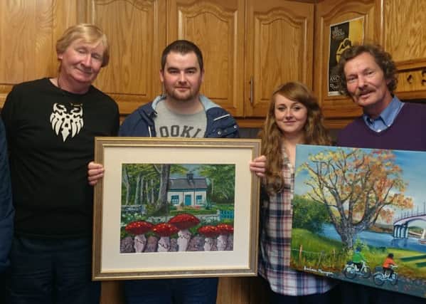 Staff and members from Beacon Wellbeing, Clarendon Street, Derry display some of their art that will be exhibited at The Holywell Trust for 2 weeks starting September 25.