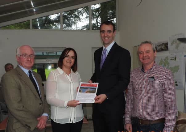 Phil McArthur - KellsVOCAL,  Eileen Russell- KellsVOCAL and  Mervyn McMullan- KellsVOCAL present their petition to Mark H Durkan, Minister of Environment. Picture submitted.
