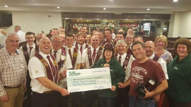 Randalstown Apprentice Boys of Derry recently presented £11,283.56 to Mac Millan cancer support after their 63.2 mile charity walk completion from Randalstown to Londonderry in a remarkable 22 1/2 walking hours.