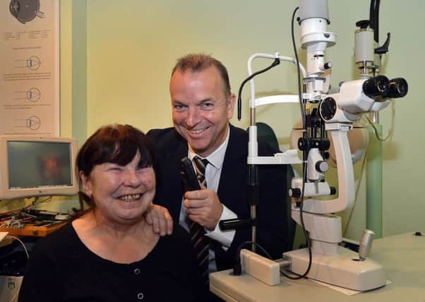Denise Wilson who believes her life was saved through an eye test by Eamonn Murray of Specsavers, Rushmere. INPT40-212.